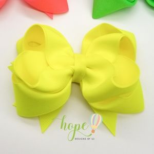 Stunning neon yellow hair bow. Handmade.